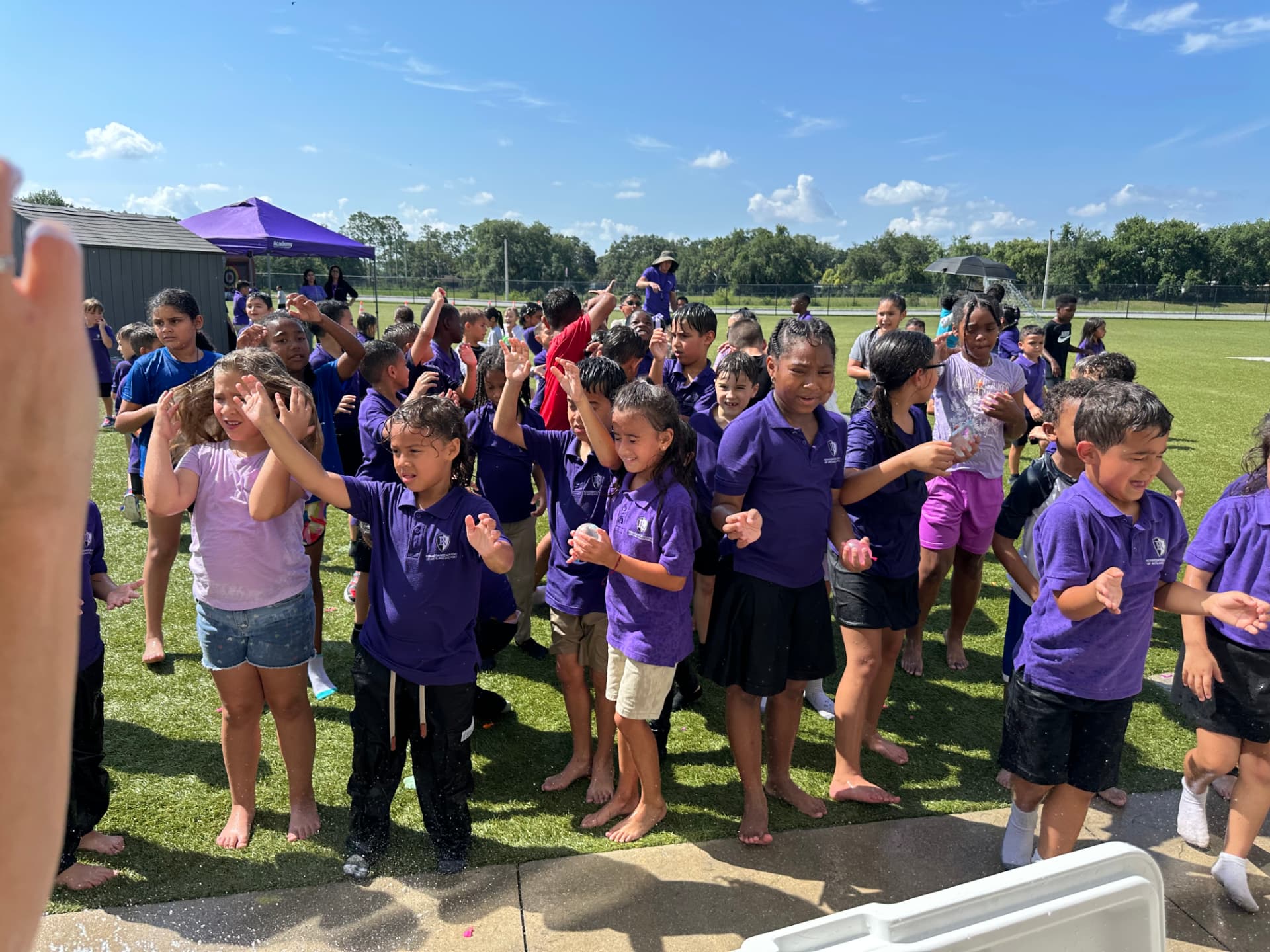 Students smiling during a Bounce Hype school event