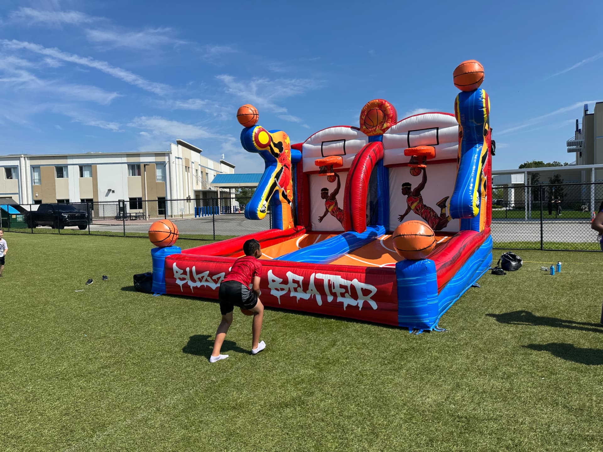Bounce Hype staff supervising students on an inflatable