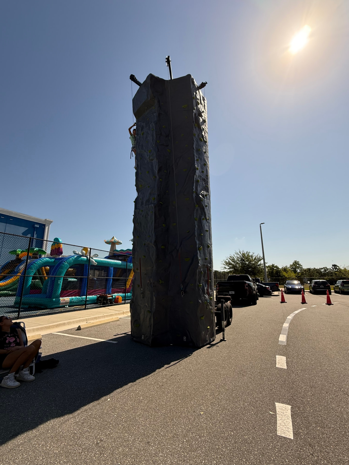 Student climbing the mobile rock climbing tower at a school event
