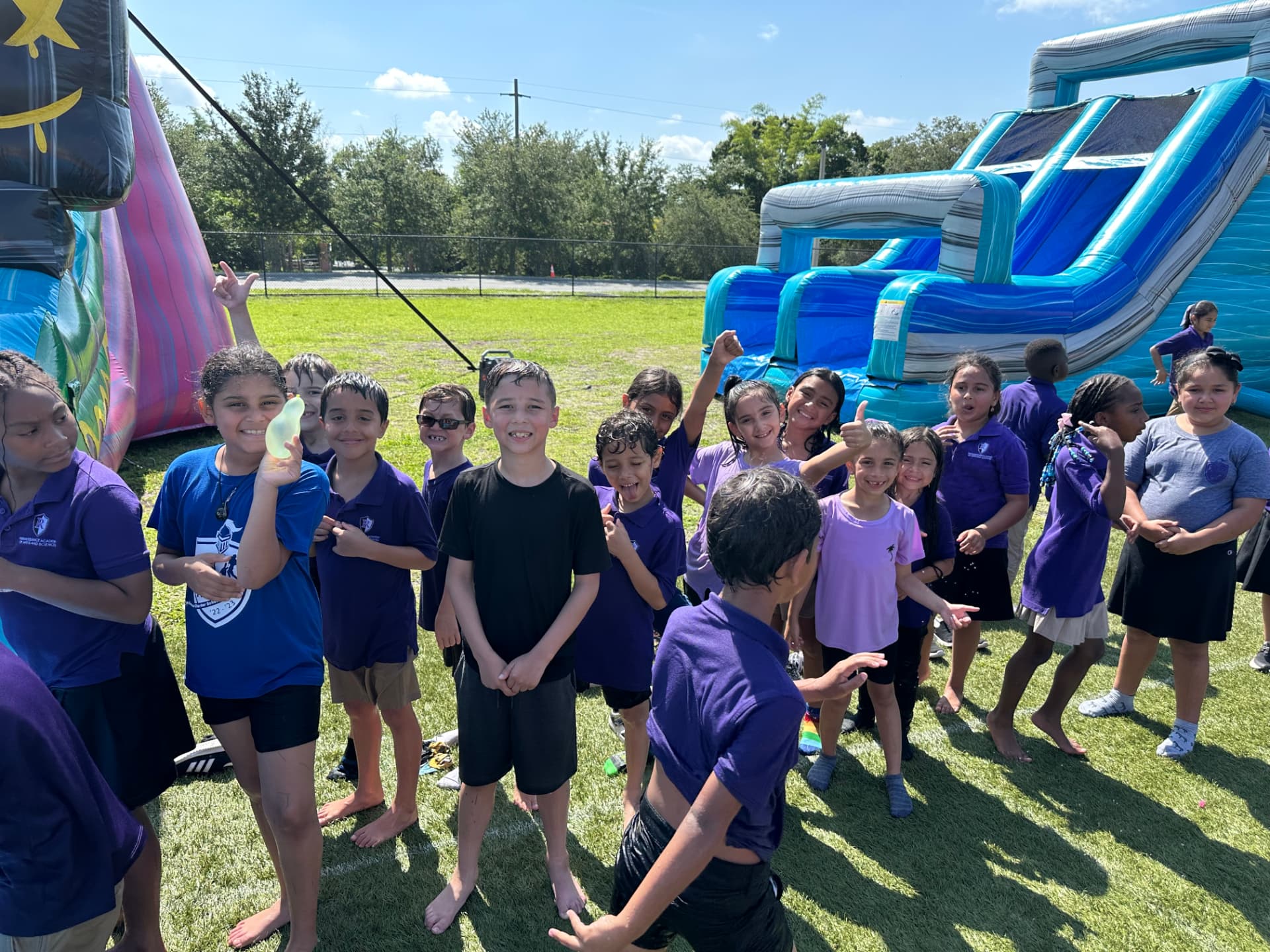 A wide, open Bounce Hype event area on a school field