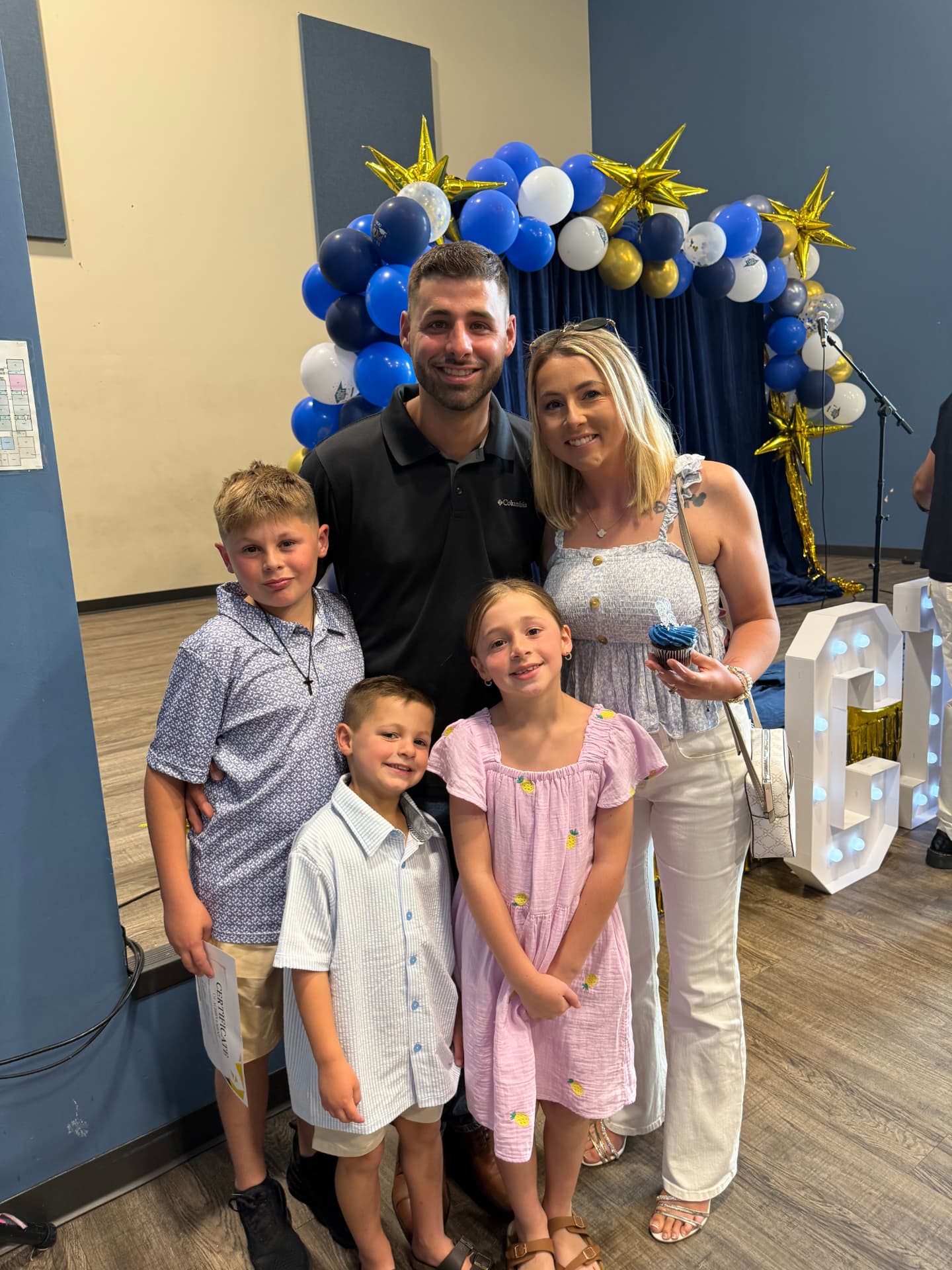 Blake and Sarah Miller with their children at a community event